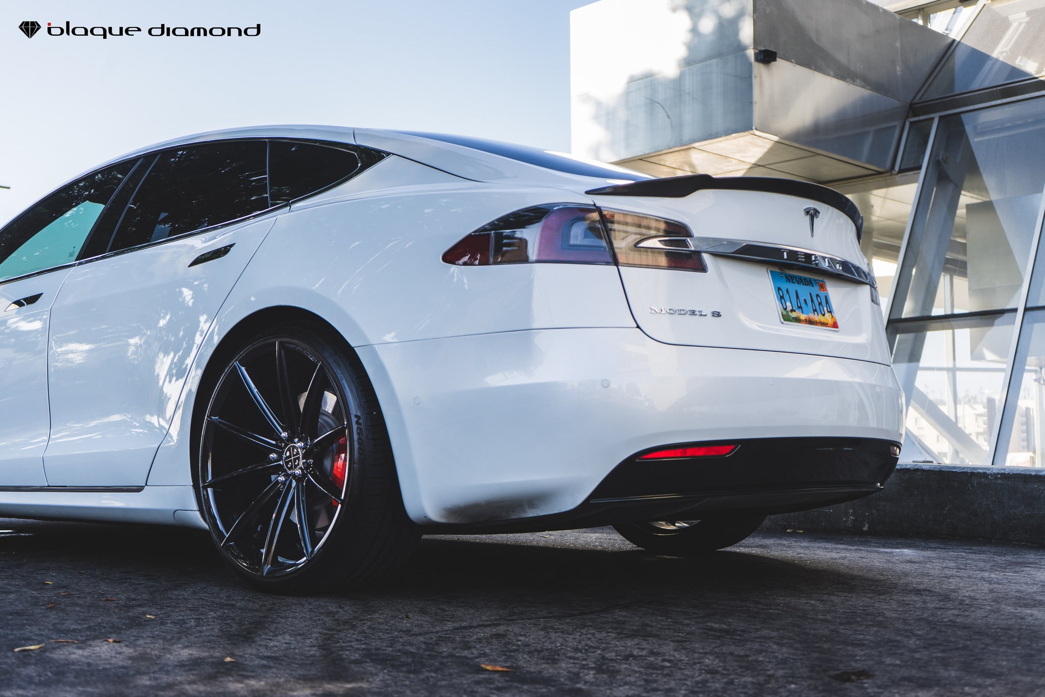 White Tesla Model S with Red Smoke Taillights - Photo by Blaque Diamond