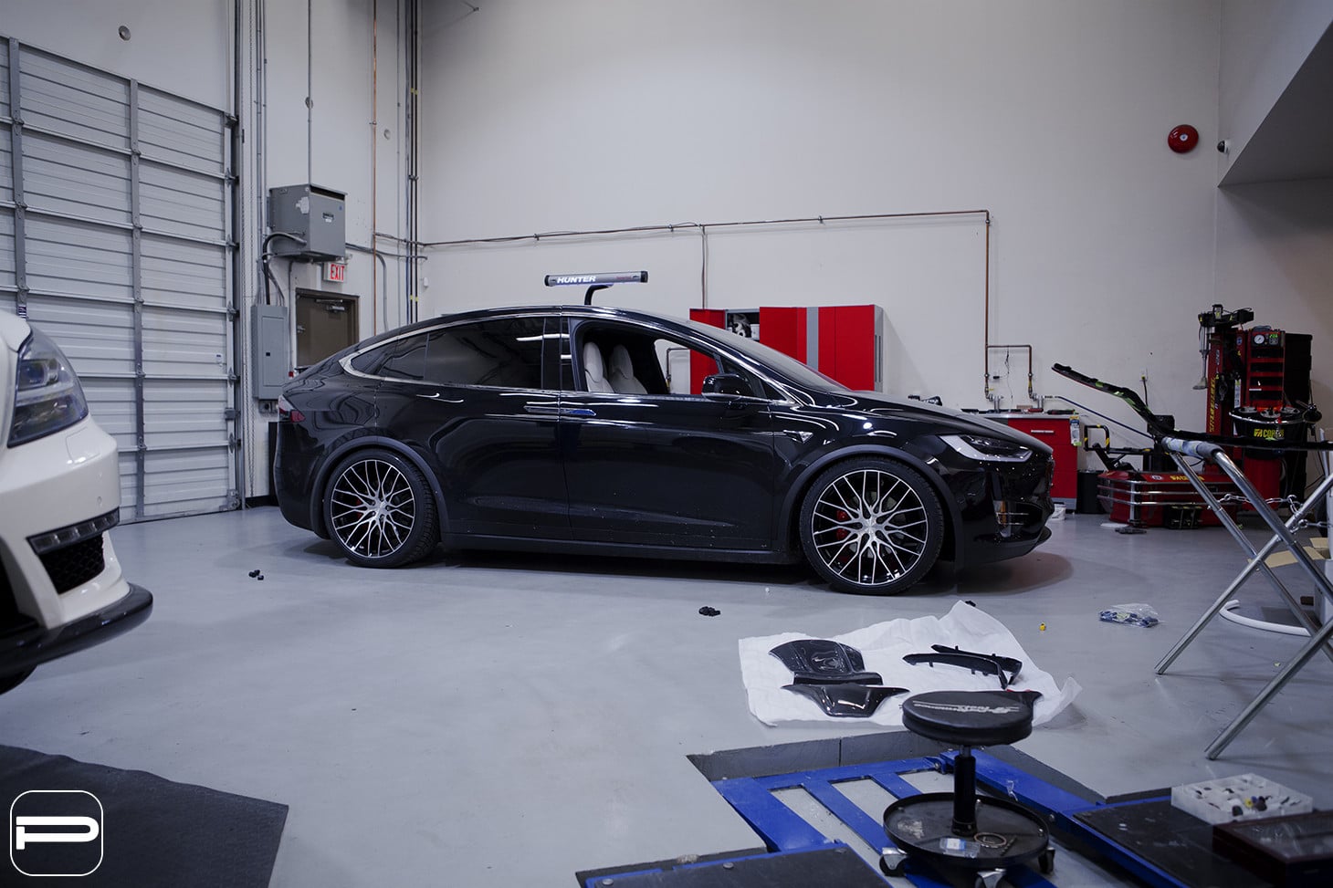 Aftermarket Side Skirts on Black Tesla Model X - Photo by PUR Wheels