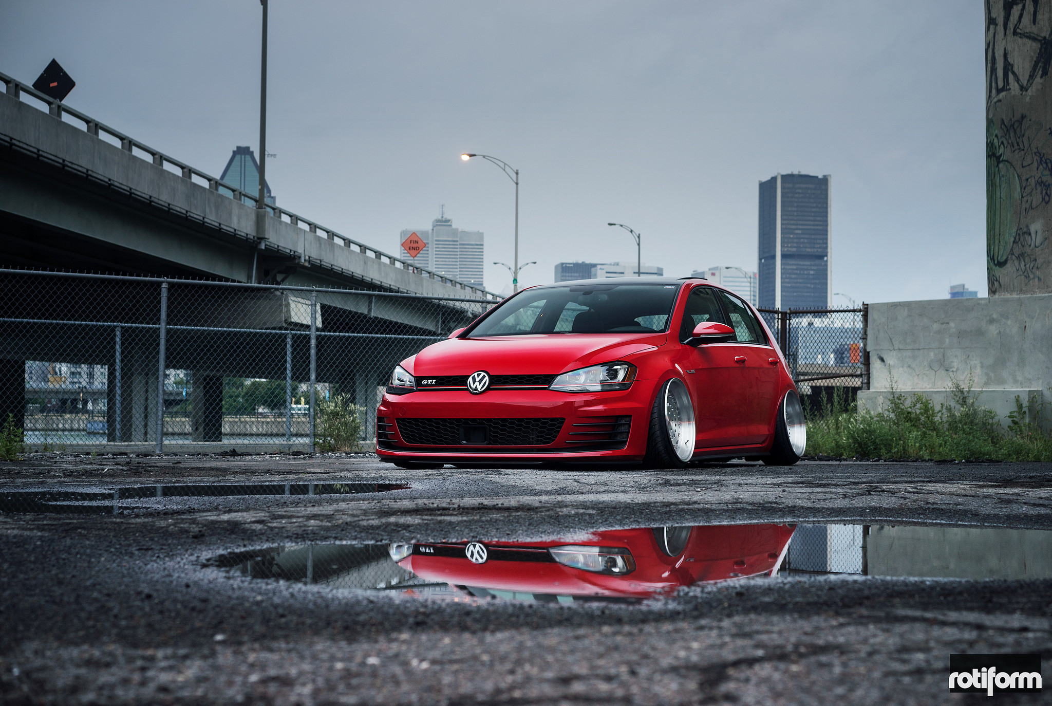Red VAG Sitting on Polished Deep Dish Wheels - Photo by Rotiform