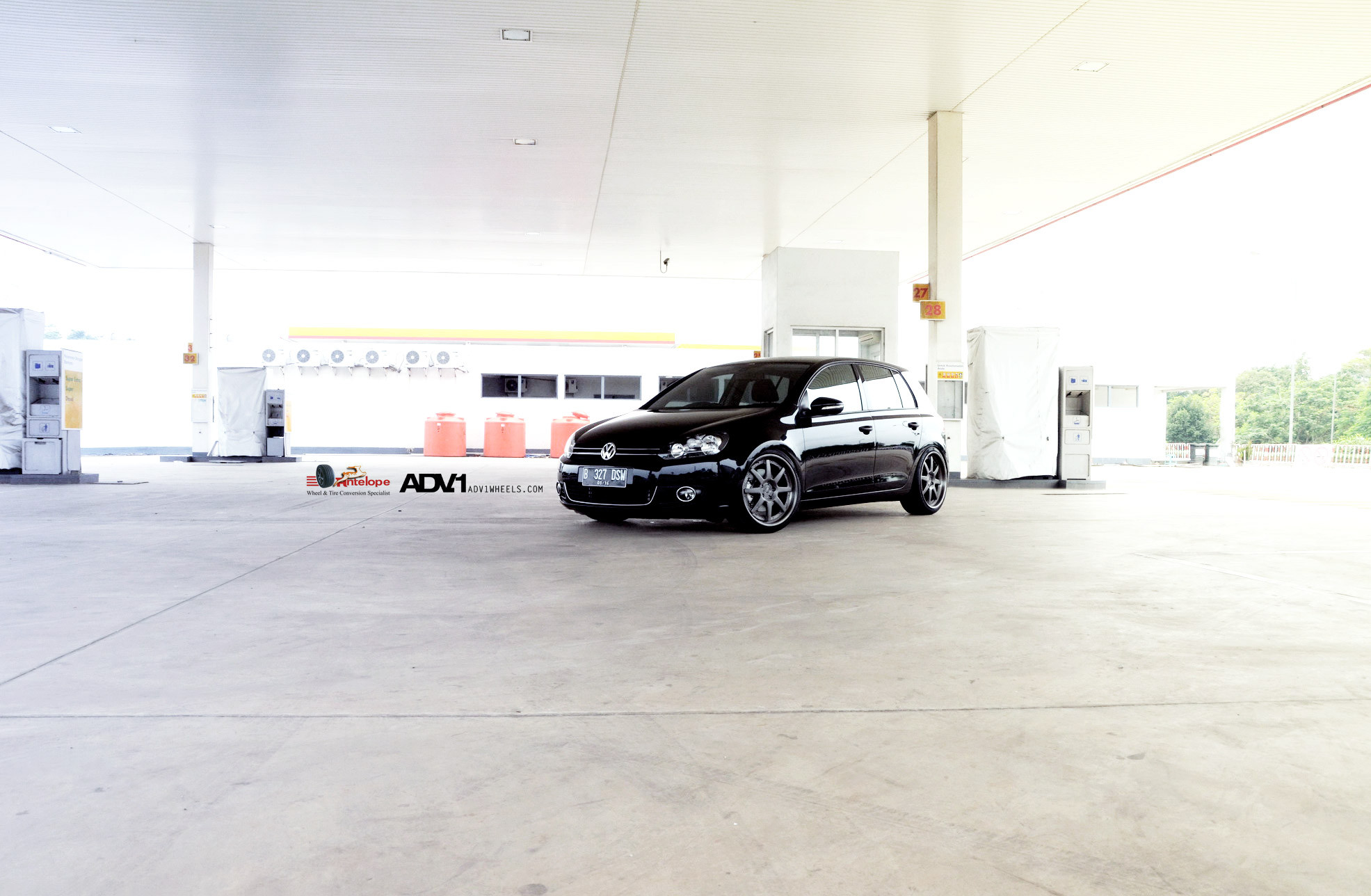 Custom Crystal Clear Headlights on Black VW Golf - Photo by ADV.1