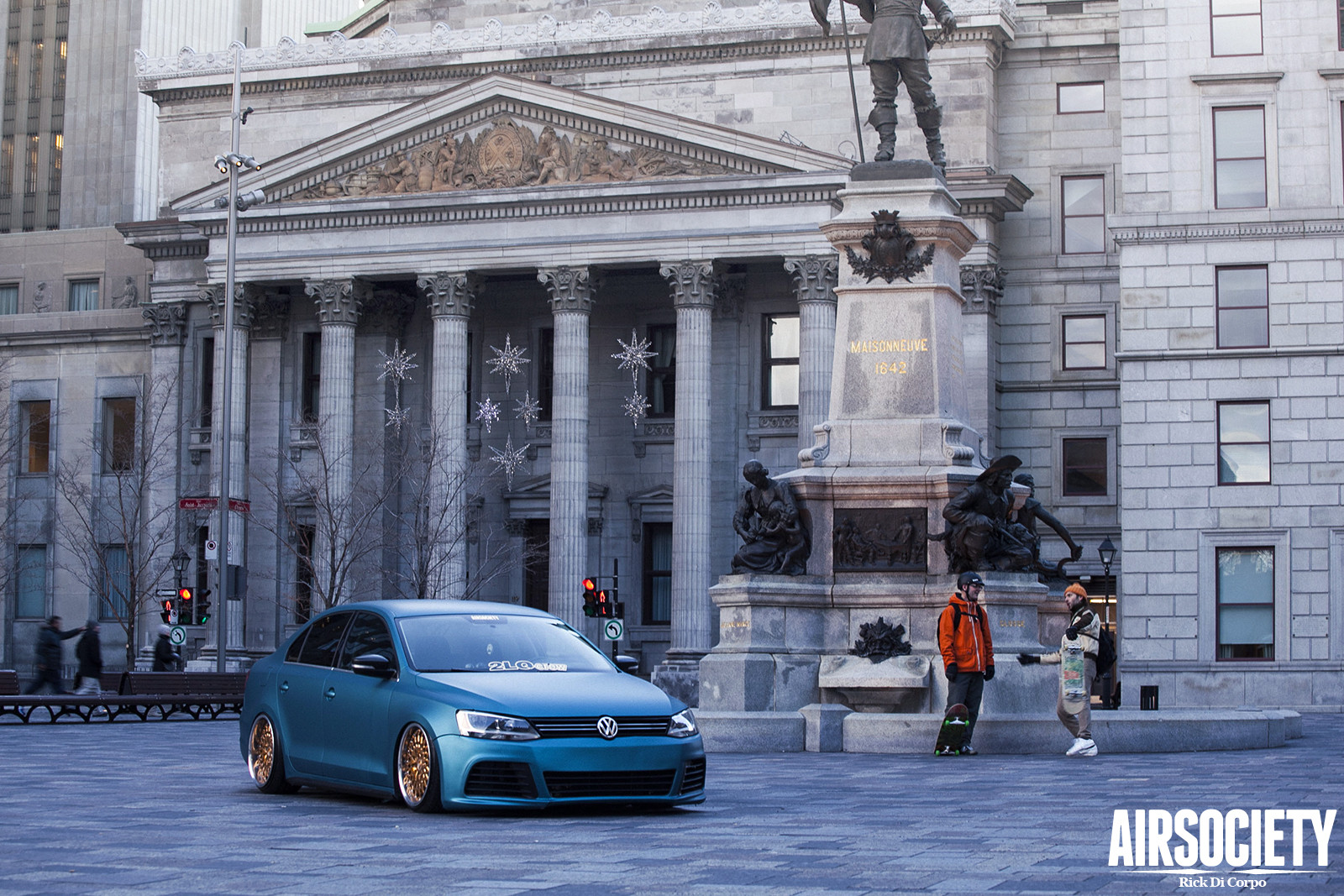 Blue VW Jetta with Aftermarket Headlights - Photo by Avant Garde Wheels
