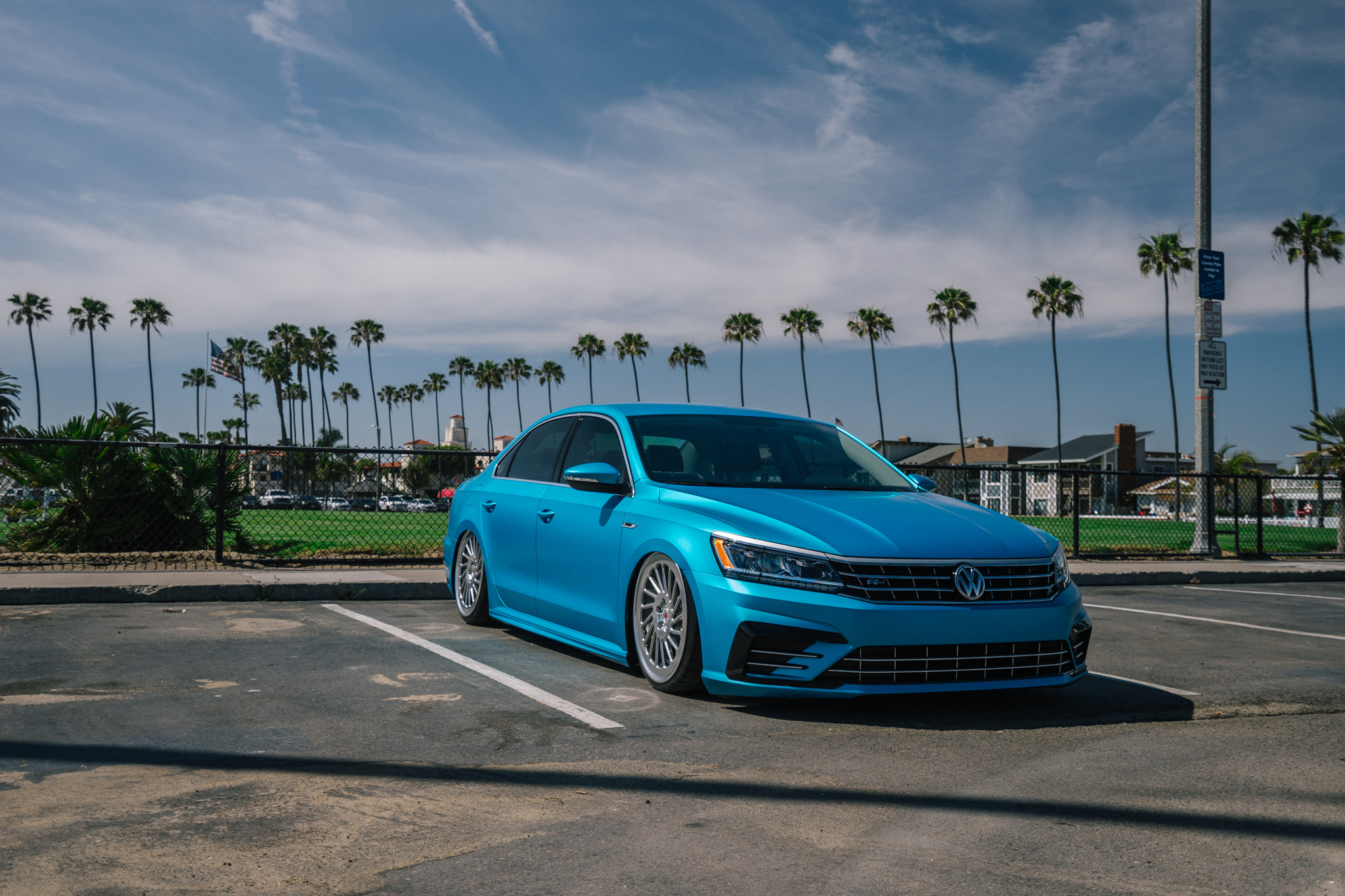 Aftermarket Projector Headlights on Blue VW Passat - Photo by Boden Autohaus