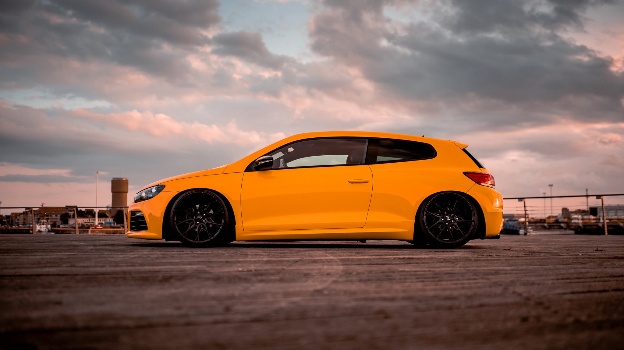 Aftermarket Side Skirts on Orange VW Scirocco - Photo by Niche Road Wheels